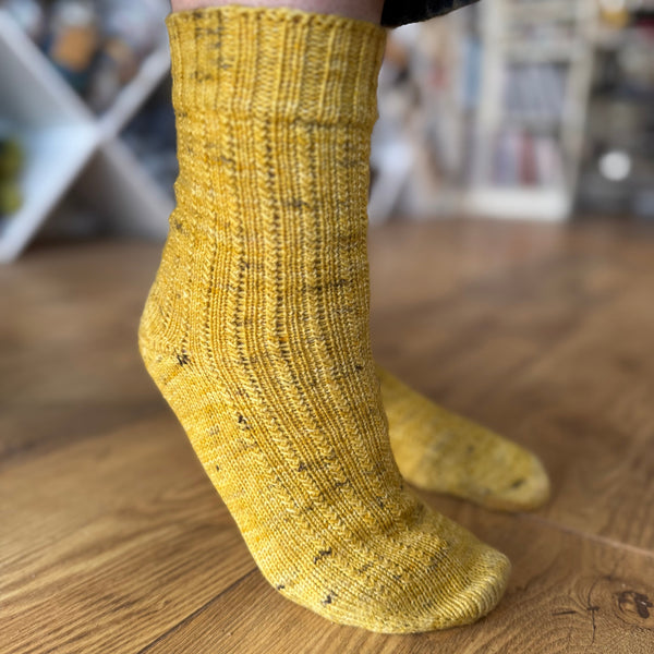 Fresh Shoots Sock Knitting Pattern by Nicky Jerrome for All About the Yarn shown in Skein Queen Crush 4-ply sock yarn in Drunk Bees